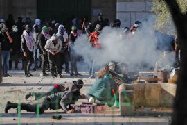 Palestinian demonstrators clash with Israeli police at Jerusalem's Al-Aqsa Mosque compound