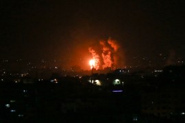 Flames and smoke rise during Israeli airstrikes central Gaza strip in on April 21, 2022. -