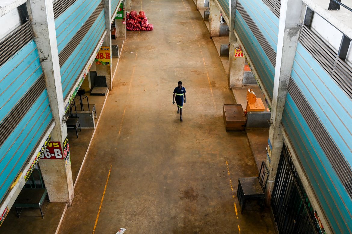 A worker walks at the deserted Manin marke