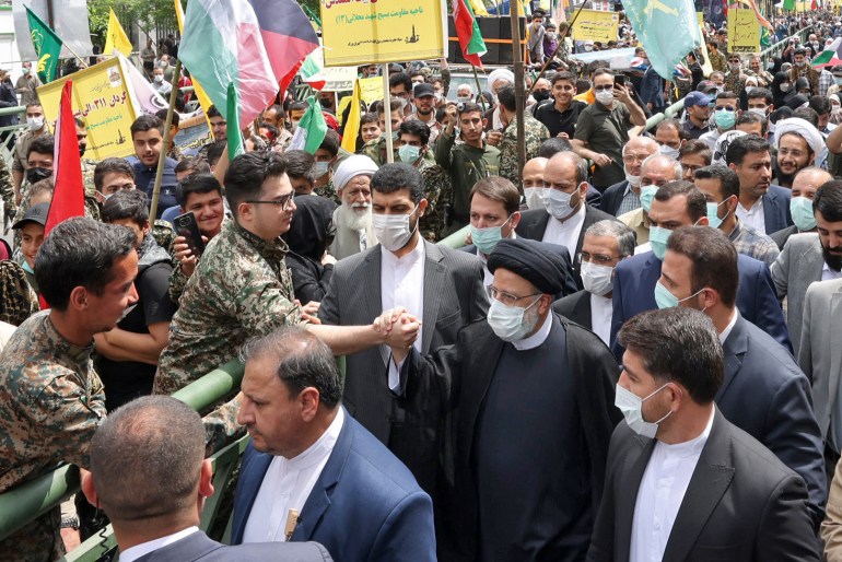 A handout picture provided by the Iranian presidential office shows Iranian president Ebrahim Raisi taking part in a rally marking al-Quds (Jerusalem) day in Tehran on April 29, 2022.