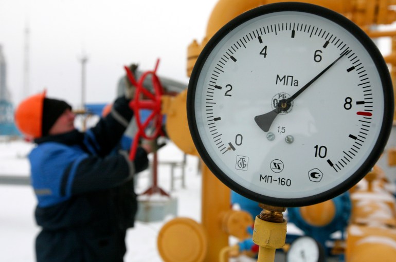 A worker turns a valve at the Nesvizhskaya compressor station in January 9, 2009.