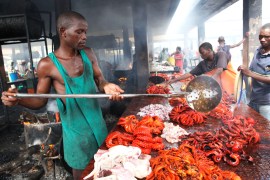 Tanzanian traders deep-fry freshly caught octopus in order to keep them from turning bad at a market near the shores of the commercial capital Dar es Salaam