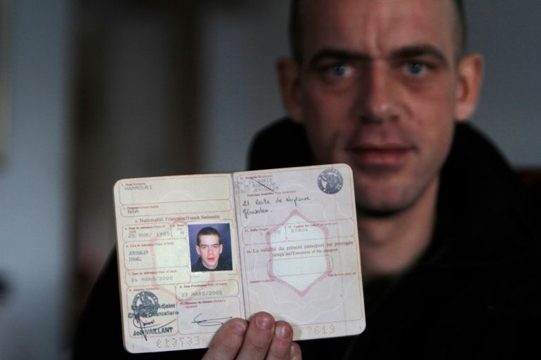 Salah Hamouri shows his French passport.