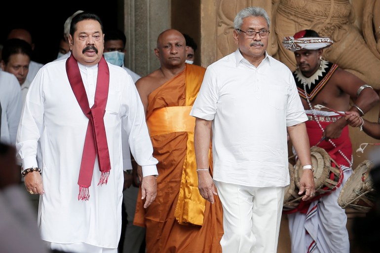 Sri Lanka's Prime Minister Mahinda Rajapaksa and his brother, and Sri Lanka's President Gotabaya Rajapaksa are seen during his during the swearing in ceremony as the new Prime Minister, at Kelaniya Buddhist temple in Colombo, Sri Lanka, August 9, 2020.