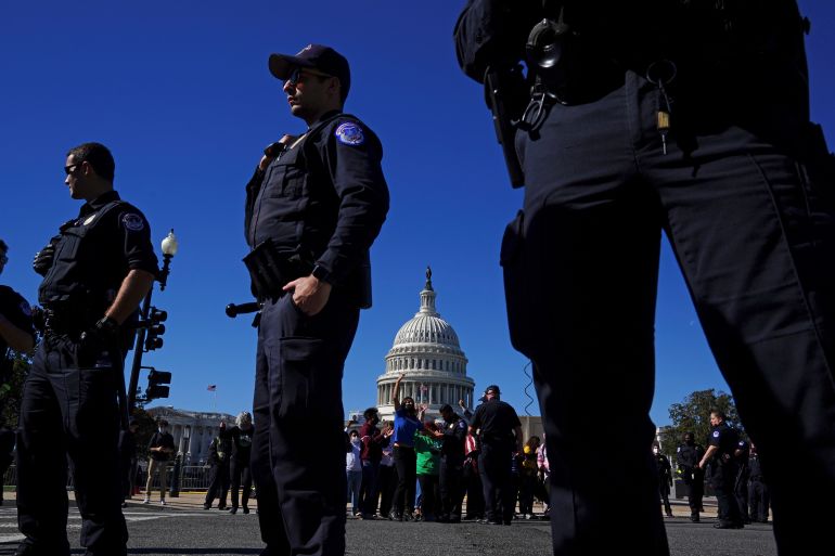 Capitol police officers detain activists from immigration, climate, and other progressive groups during a rally to call on Democrats in Congress to pass legislation on a range of issues.