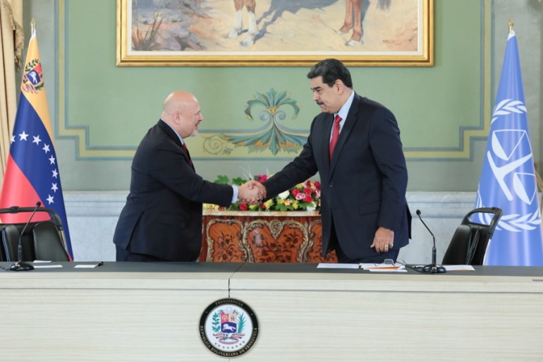 Karim Khan shaking hands with Venezuela's President Nicolas Maduro