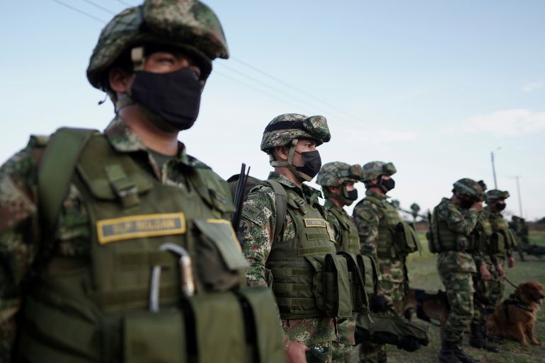 Colombian soldiers stand in a line.