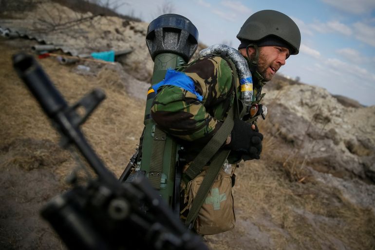 A Ukrainian service member holds a next generation light anti-tank weapon