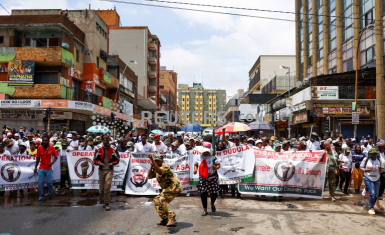Members of the South African anti-migrant group, operating under the slogan "Put South Africa First", take part in a peaceful campaign to force undocumented foreigners out of informal trading at Johannesburg's Hillbrow suburb. February 19, 2022. [File: Siphiwe Sibeko/Reuters]