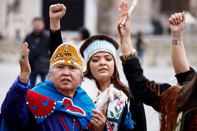 First Nations women gesture in Rome after the pope's apology for residential school abuses