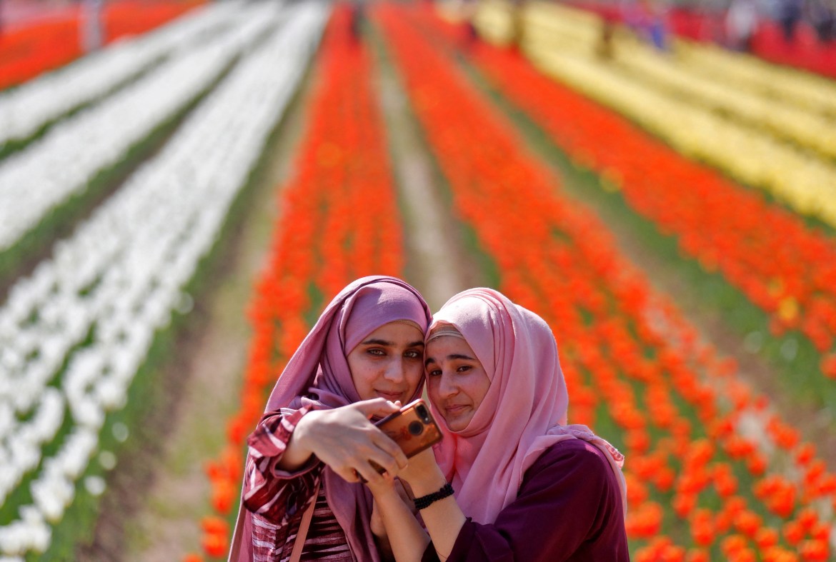 Girls take a selfie inside Kashmir's tulip garden