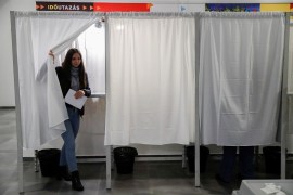 A woman votes at a polling station during the Hungarian parliamentary election, in Budapest, Hungary,