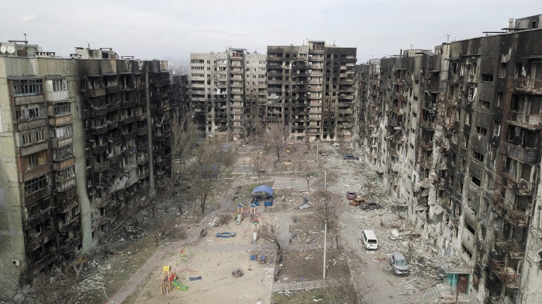 An aerial view shows damaged residential buildings in Mariupol 