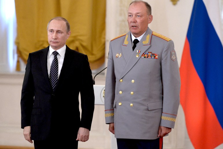 Russian President Vladimir Putin poses for a picture with General Alexander Dvornikov after he was awarded the title of Hero of the Russian Federation in Moscow, Russia, in 2016.