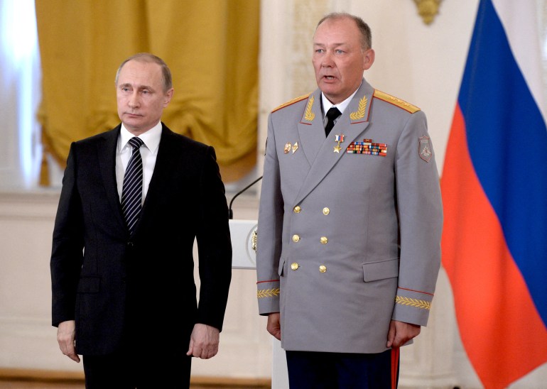 Russian President Vladimir Putin poses for a picture with General Alexander Dvornikov after he was awarded the title of Hero of the Russian Federation in Moscow, Russia, in 2016.