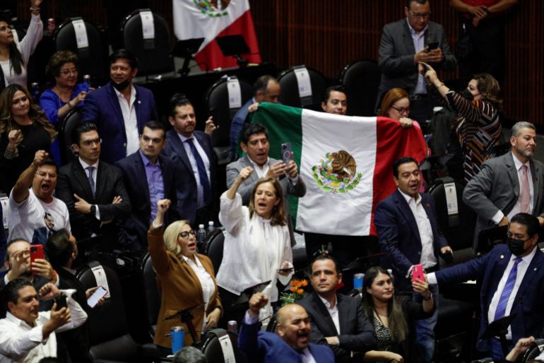 Opposition legislators react in Mexico's lower house of Congress