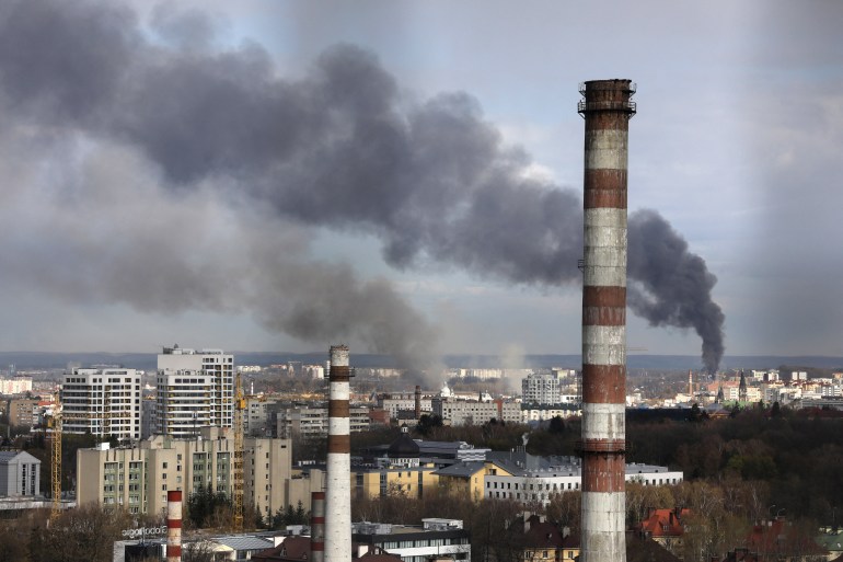 Smoke is seen in Lviv after Russian missile strikes in the city