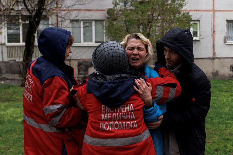 A woman is seen crying in Kharkiv