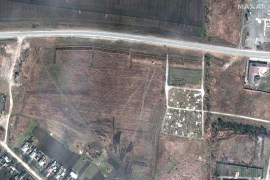 A satellite image shows an overview of a cemetery and expansion of the new graves in Manhush, near Mariupol, Ukraine on April 3, 2022 [Satellite image 2022 Maxar Technologies/Reuters]
