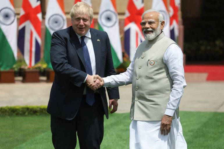 British Prime Minister Boris Johnson and Indian Prime Minister Narendra Modi shaking hands
