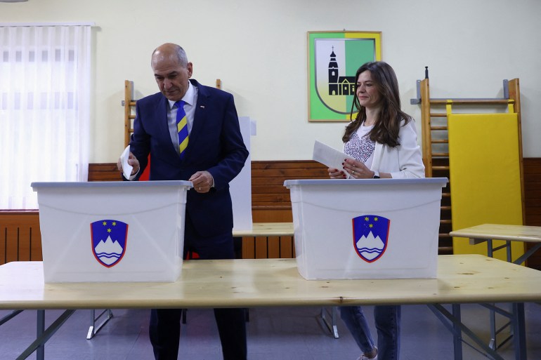 Slovenian Prime minister Janez Jansa and his wife Urska Bacovnik Jansa vote