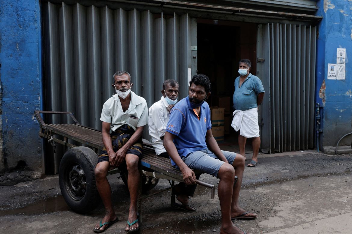 Workers are seen at a wholesale market during a nationwide strike