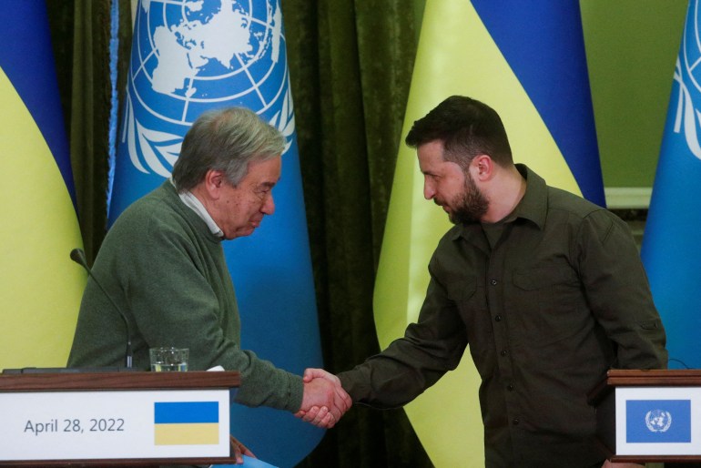 UN Secretary-General Antonio Guterres and Ukraine's President Volodymyr Zelenskiy shake hands at a joint news conference