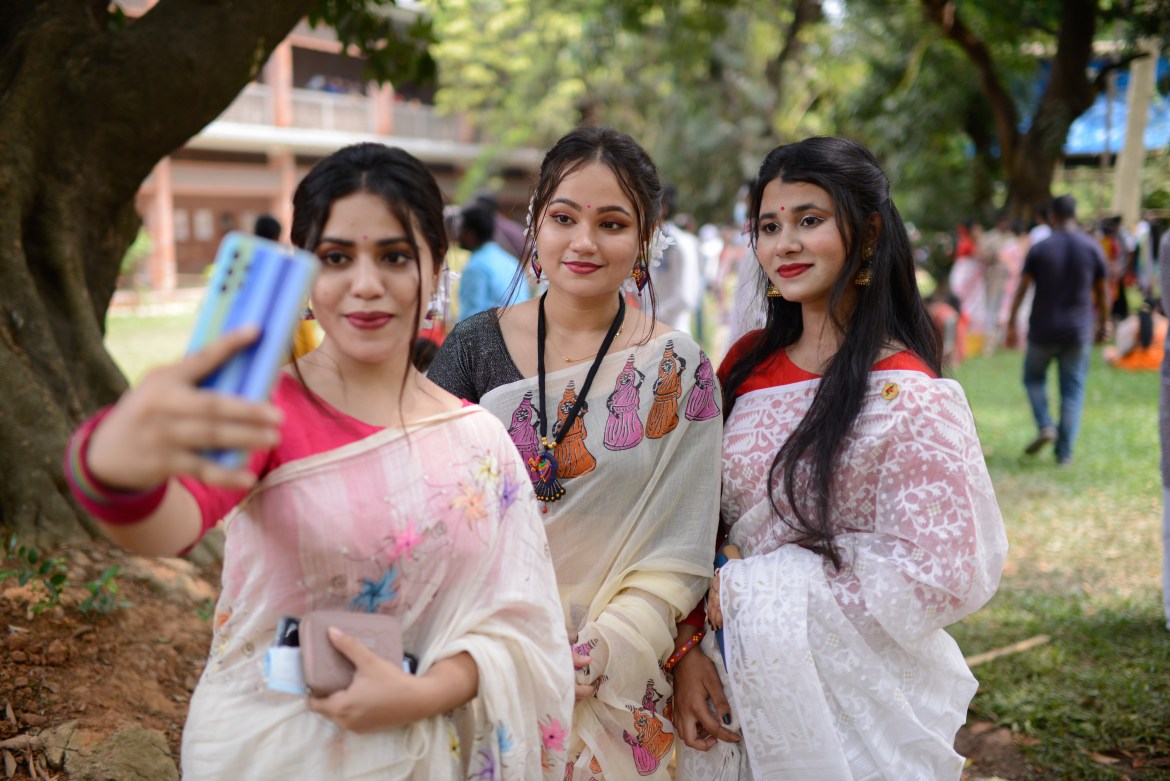 Three friends taking selfie at the Institute of Fine Arts Campus in Dhaka University.