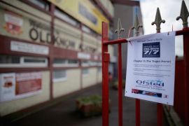 A photo of a poster against Education Secretary Michael Gove is displayed on the railings outside Oldknow Academy