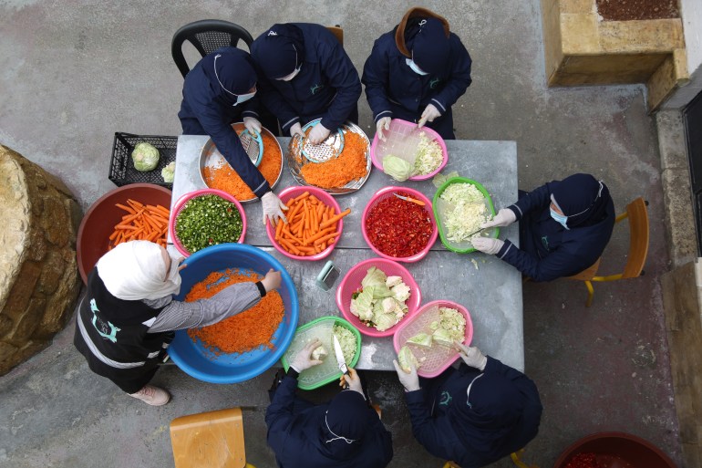 Women prepare vegetables for Ramadan meals in Idlib city, Syria (Al Jazeera)