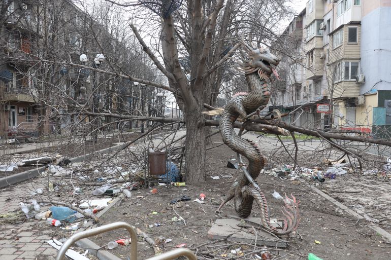 Damage on a street during ongoing conflicts in the city of Mariupol, Ukraine, under the control of the Russian military and pro-Russian separatists.