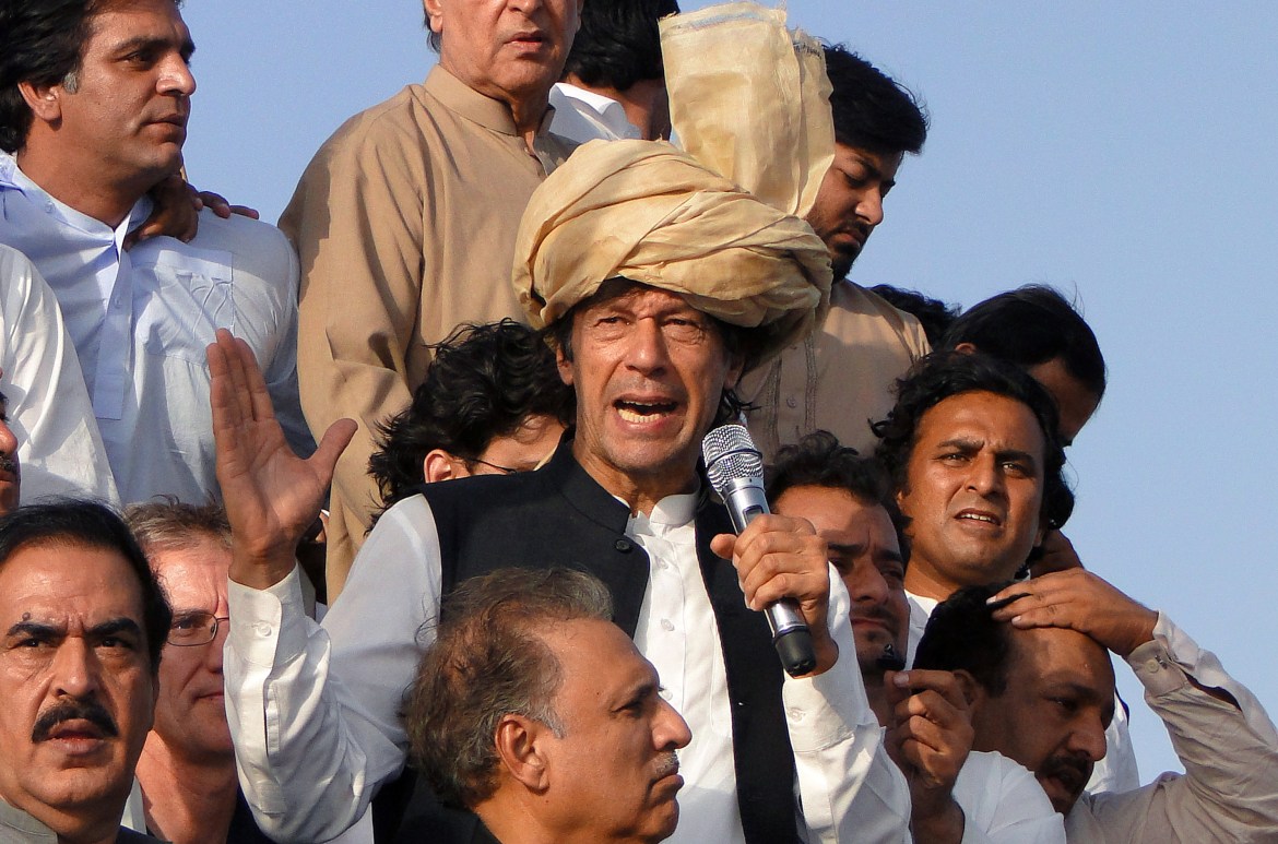 Pakistan's ex-cricket star-turned-politician Imran Khan, center, addresses his supporters during a peace march in Tank, Pakistan
