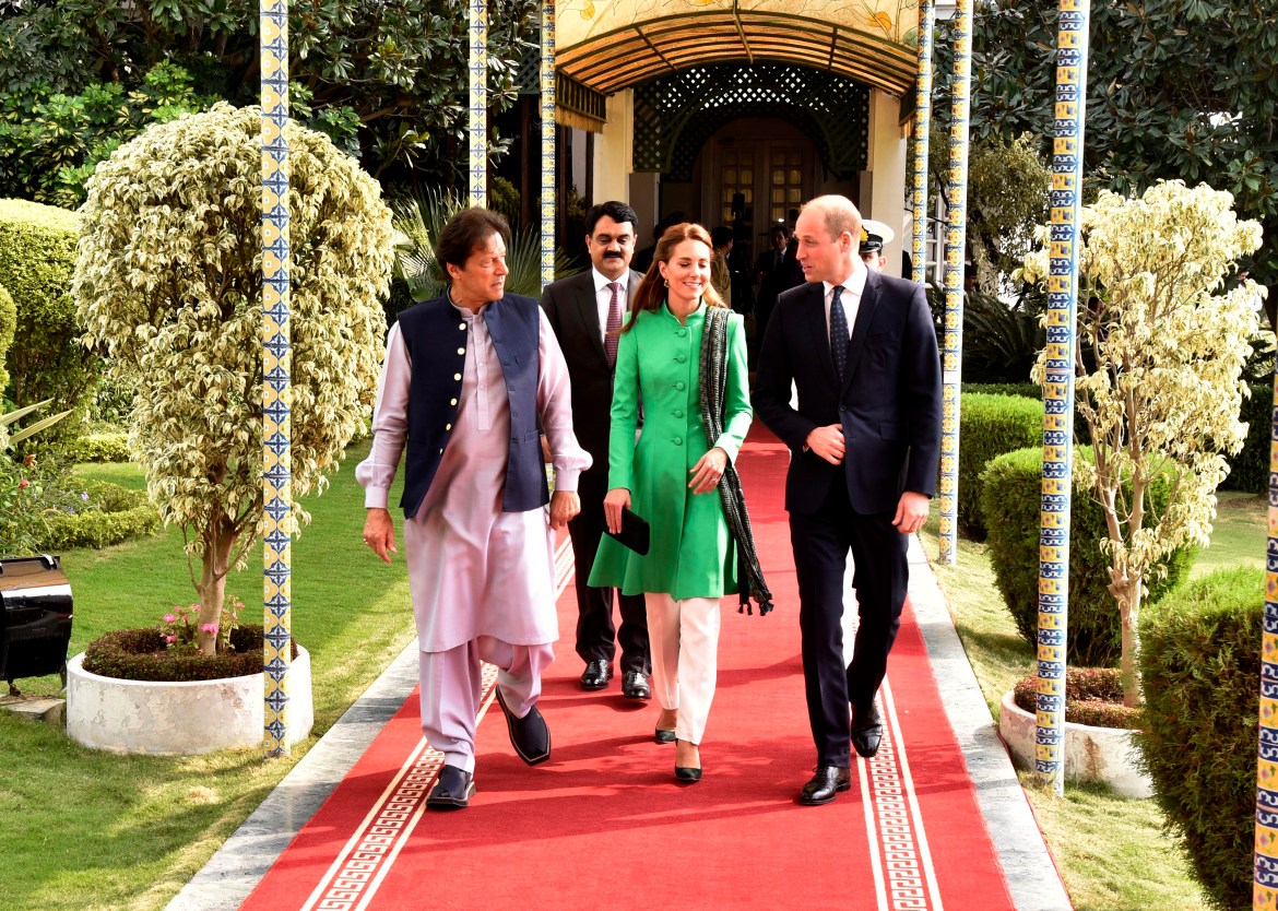 Britain's Prince William, right, and his wife Kate meet Pakistani Prime Minister Imran Khan, left, in Islamabad, Pakistan,