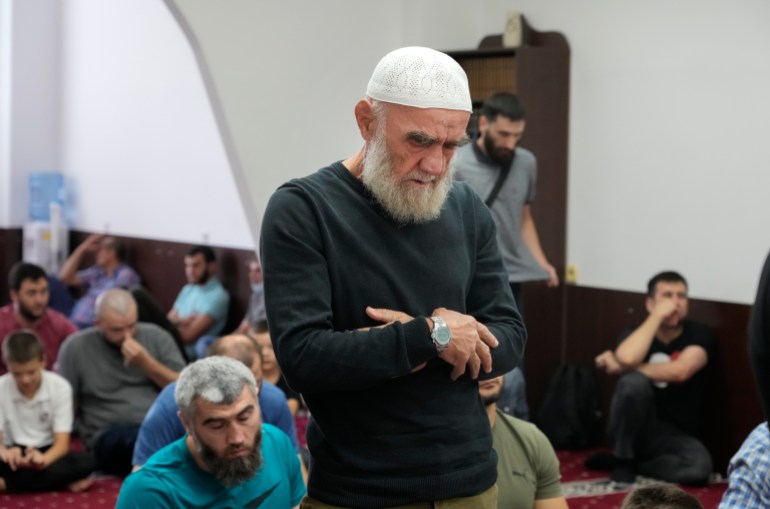 Crimean Tatars pray ina mosque in Kyiv, Ukraine, Friday, Aug. 13, 2021.