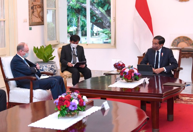 Indonesian President Joko Widodo meets with a senior Russian official at the presidential palace in Jakarta.