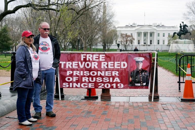 Joey and Paula Reed, parents of US Marine Corps veteran and Russian prisoner Trevor Reed, stand in Lafayette Park near the White House