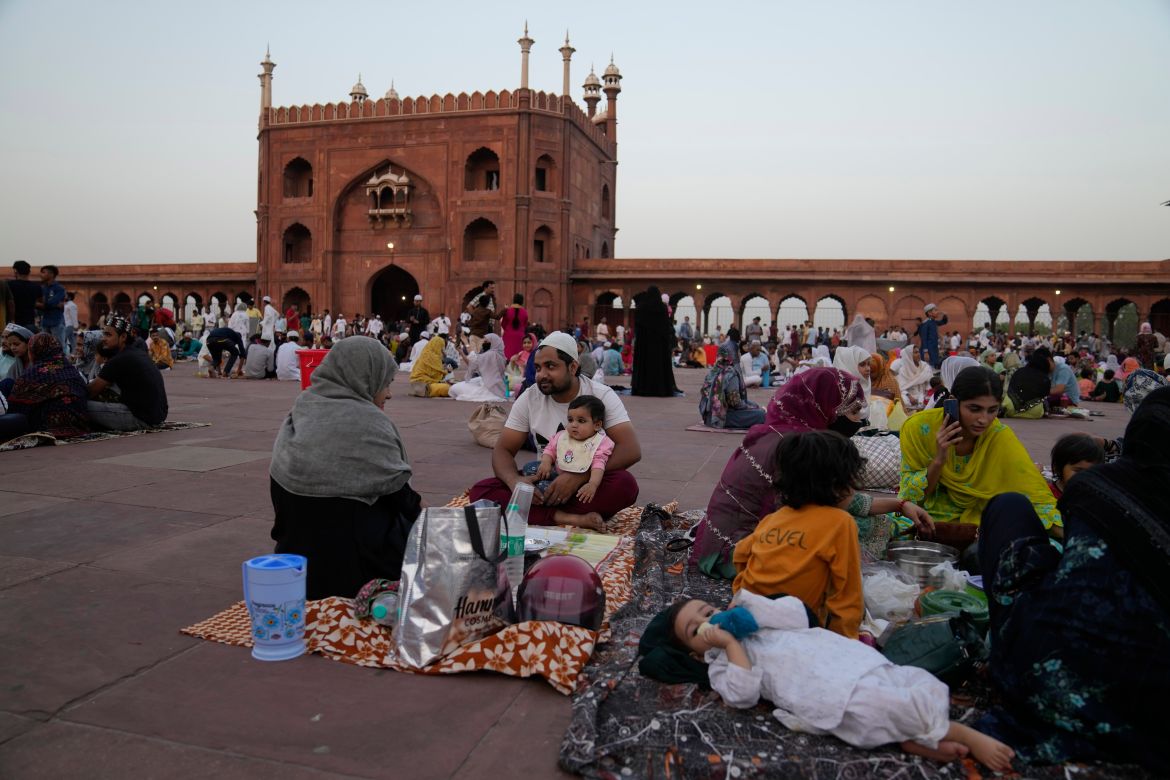 Indian Muslims wait to break their fast on the first day of the holy