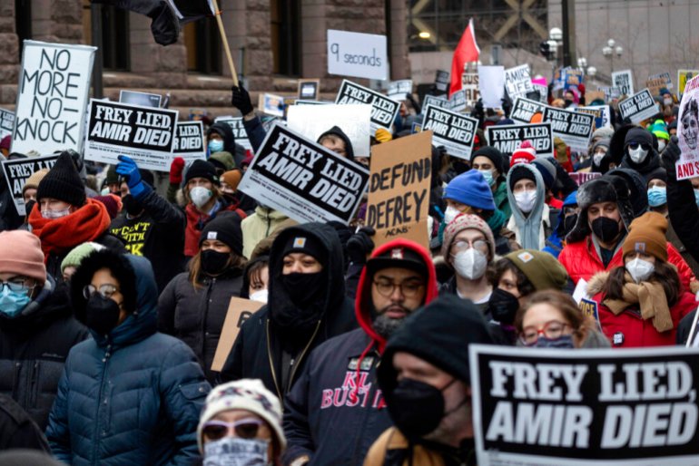  People march at a rally for Amir Locke on Saturday, Feb. 5, 2022, in Minneapolis.
