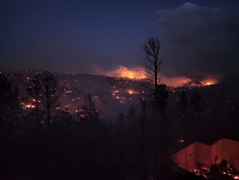Fire burns along a hillside in the Village of Ruidoso, New Mexico, US