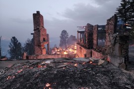 The remains of a home left after a wildfire spread through the Village of Ruidoso, New Mexico,