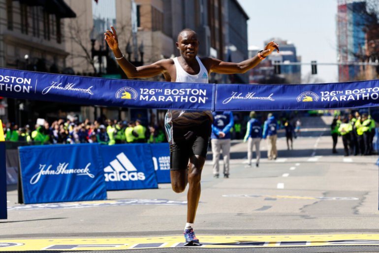 Evans Chebet, of Kenya, hits the finish line to win the 126th Boston Marathon.