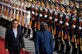 Chinese Premier Li Keqiang, left, and Solomon Islands Prime Minister Manasseh Sogavare review an honour guard during a welcome ceremony at the Great Hall of the People in Beijing in 2019
