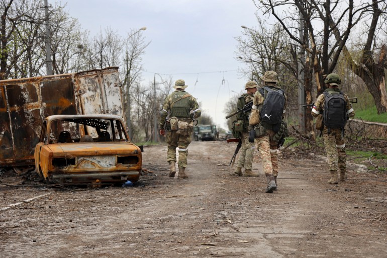 Russia-backed separatist forces are seen on patrol in Mariupol
