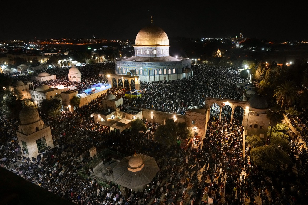 Palestinian Muslim worshippers pray during Laylat Al Qadr,