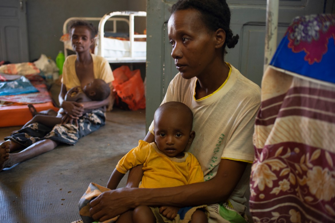 Vilisoa brought her 6-month-old son, Manda, to Ambovombe hospital where he is being treated for complications from acute malnutrition, although she said the journey means her other five children will have to search for food without her. [Joseph Stepansky/Al Jazeera]