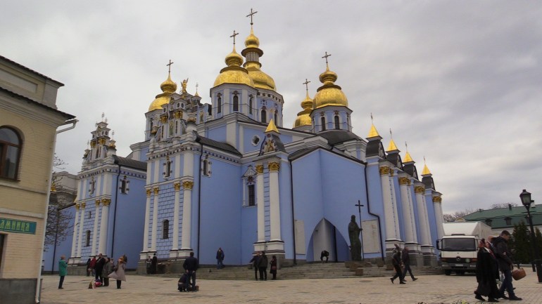 Believers near the St. Michael's Monastery in Kyiv [Mansur Mirovalev/Al Jazeera]