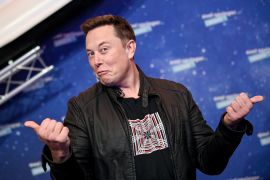 Elon Musk gives two thumbs up on the red carpet of an award show in Berlin, Germany