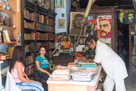 People browse through second hand books in a book shop in Havana