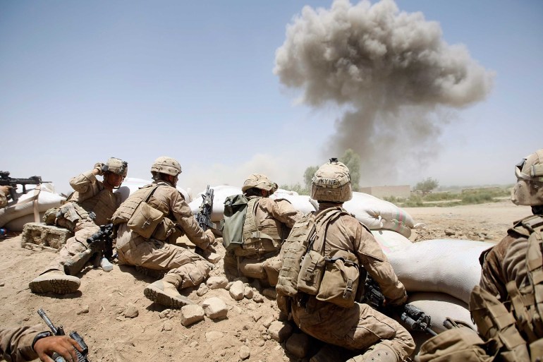 US Marines take cover as a bomb explodes in Afghanistan