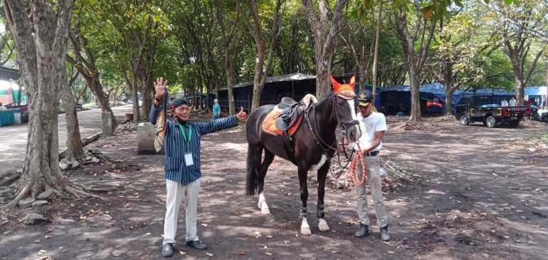 Pak Gofur, a sought after rain shaman in Surabaya, conducts a weather ceremony with a horse